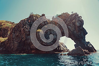 Rock â€œDragonâ€ in the sea Stock Photo